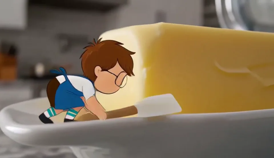 A miniature animated chef in a real kitchen